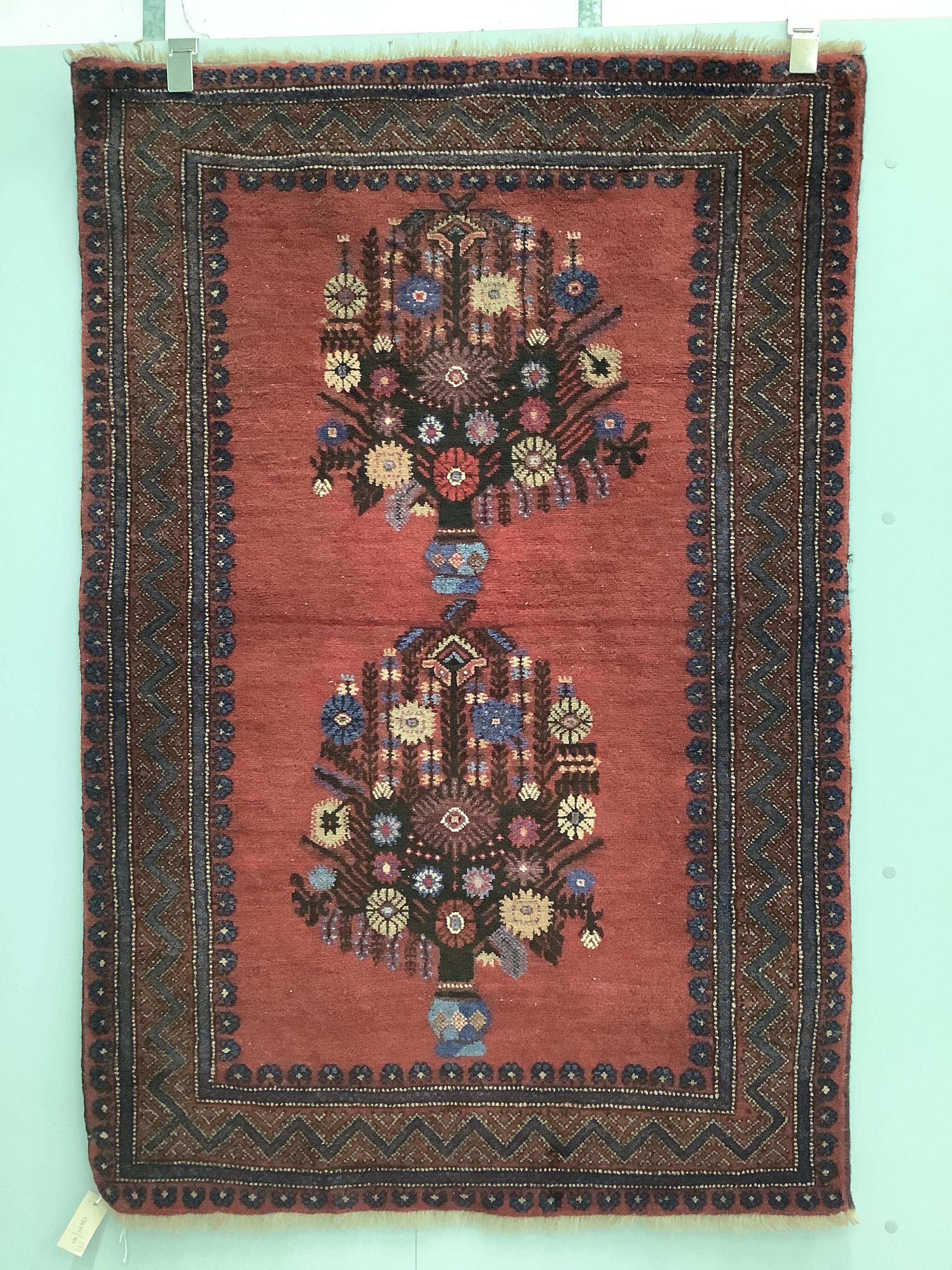 Two Persian red ground rugs, larger 148 x 102cm